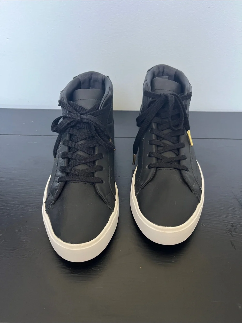 Adidas W/7.5 Black High-Top Sneakers/ white sole and gold logo.